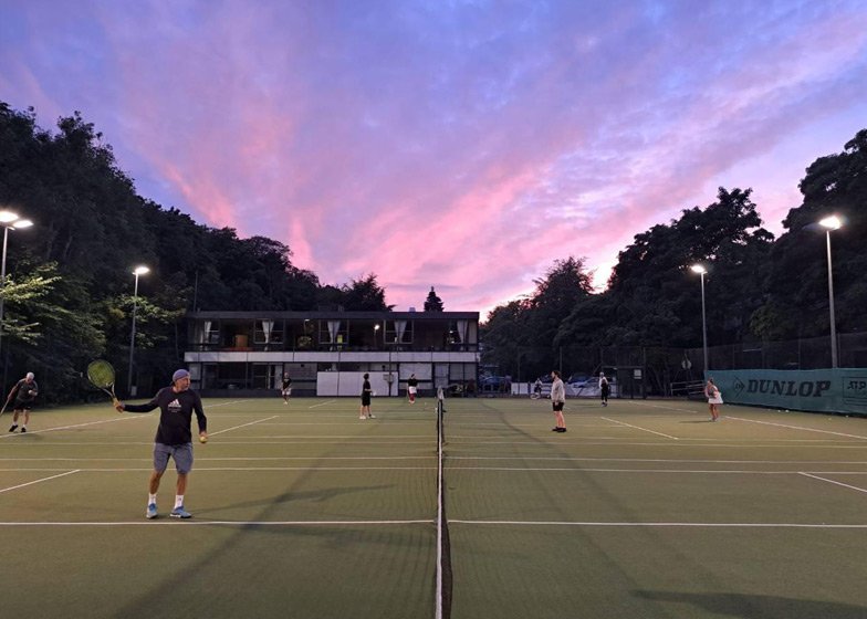Kenny Petrie tennis coaching at sunset